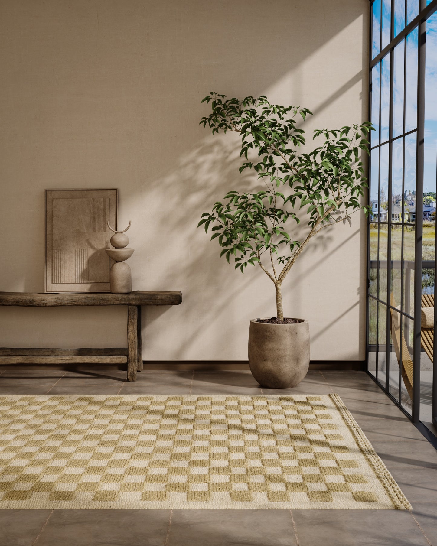 Beige and cream checkerboard woven area rug in a modern living room with a potted tree, wooden bench and glass wall.