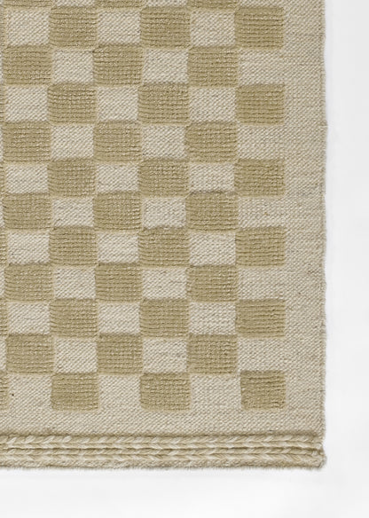 Beige and cream checkerboard woven rug with braided border fringe.