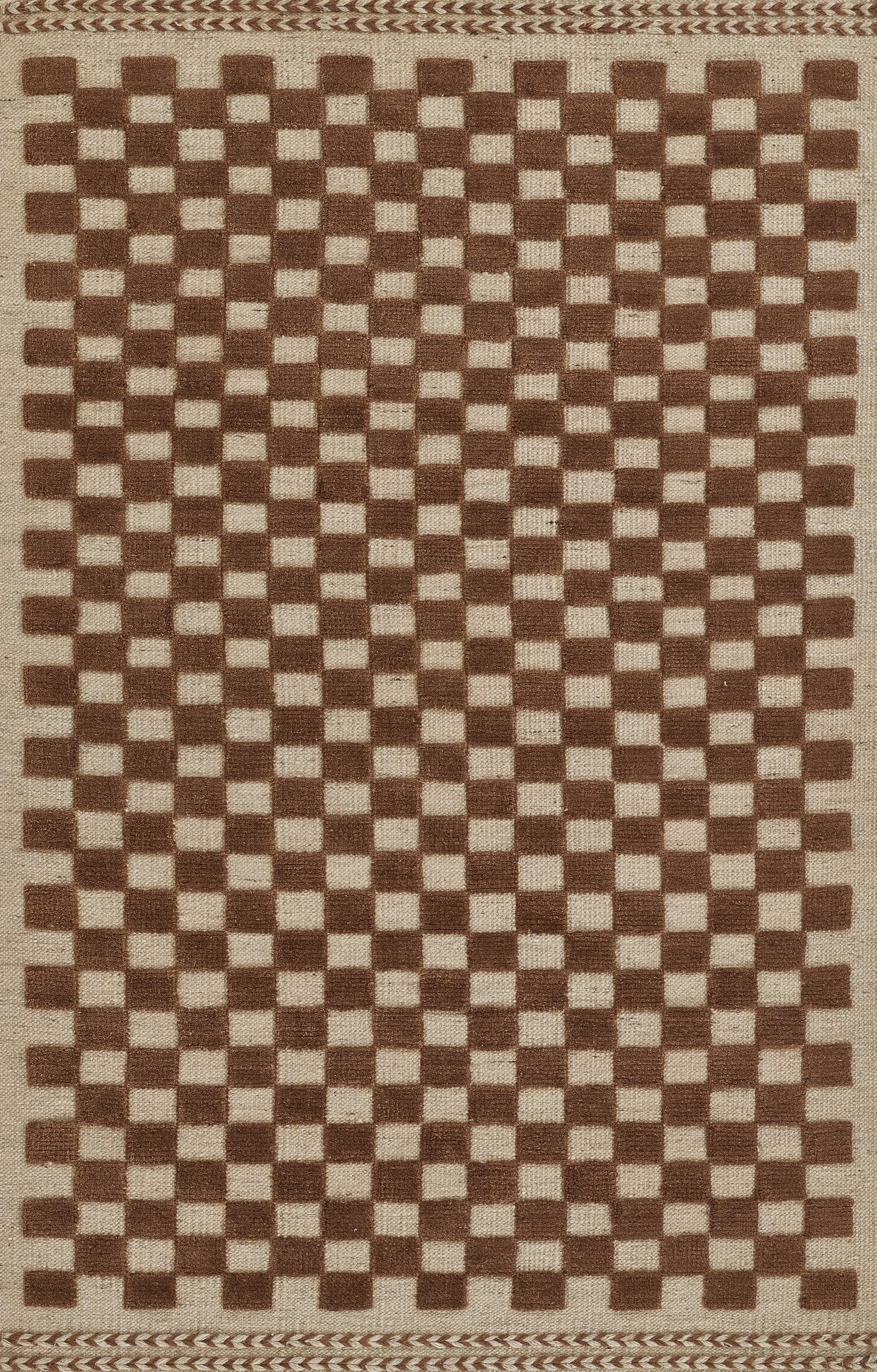 Brown and beige checkered woven rug with a braided border; natural jute texture, rectangular rustic style.