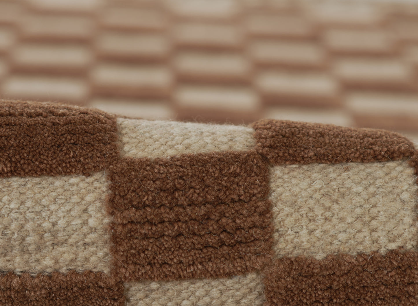Brown and beige checkered rug with soft boucle texture.