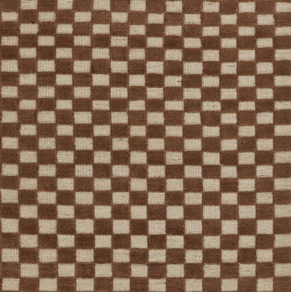 Brown and beige checker pattern rug with a small square grid; 6'3" x 9'.