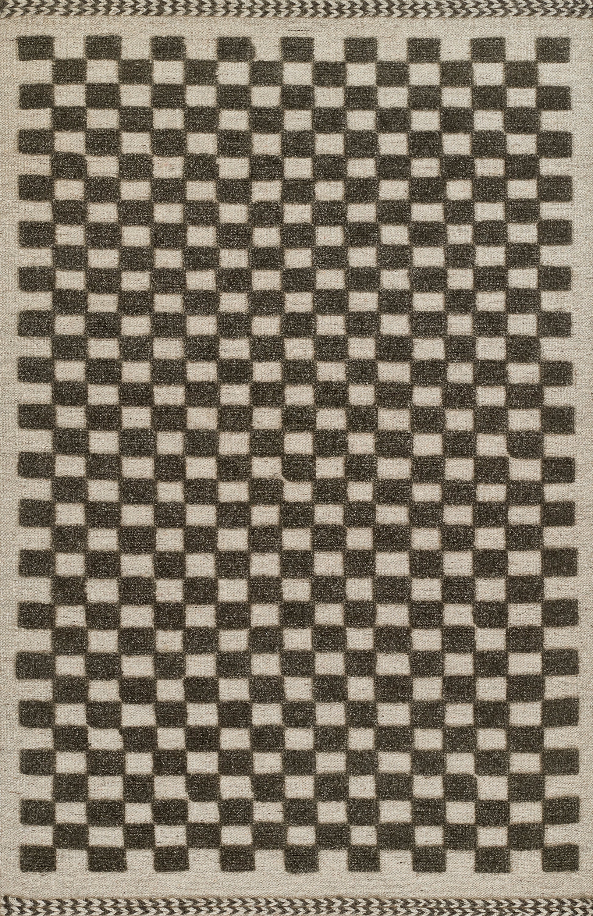 Rectangular woven rug with natural beige base and black checkerboard squares; geometric pattern with braided border.