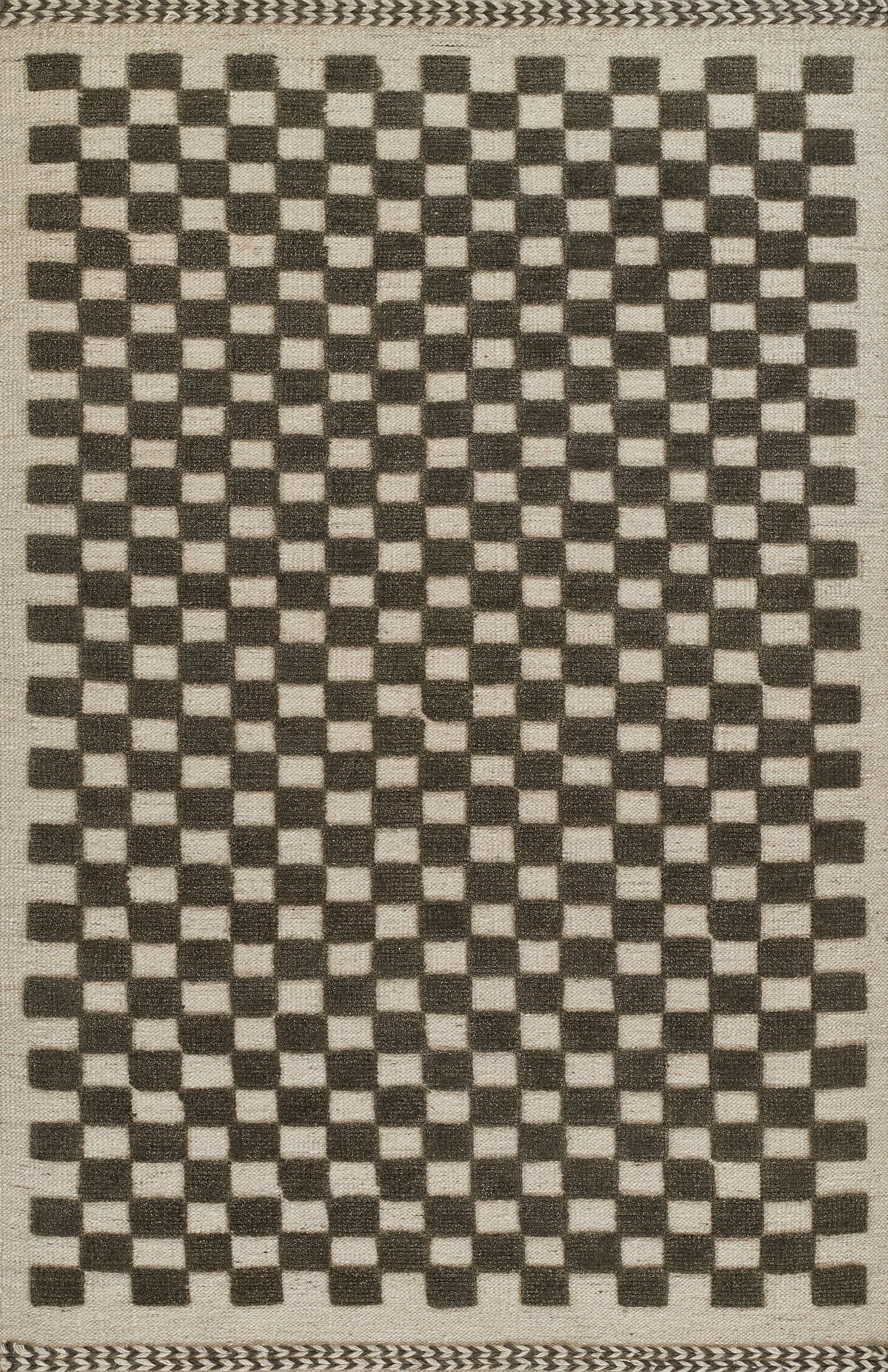 Rectangular woven rug with black and beige checkerboard pattern and braided border; jute-cotton texture for casual floors