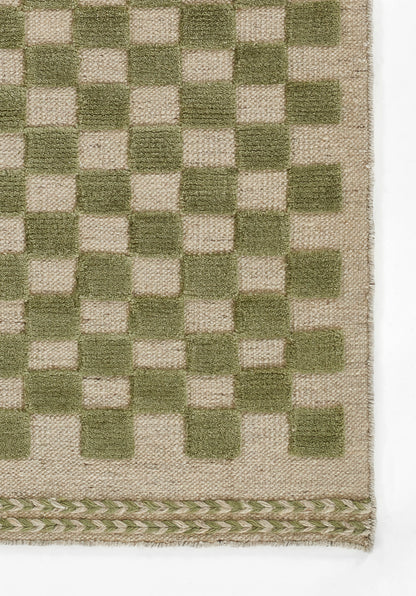 Olive green and natural beige woven rug with a checkerboard pattern and braided bottom border.