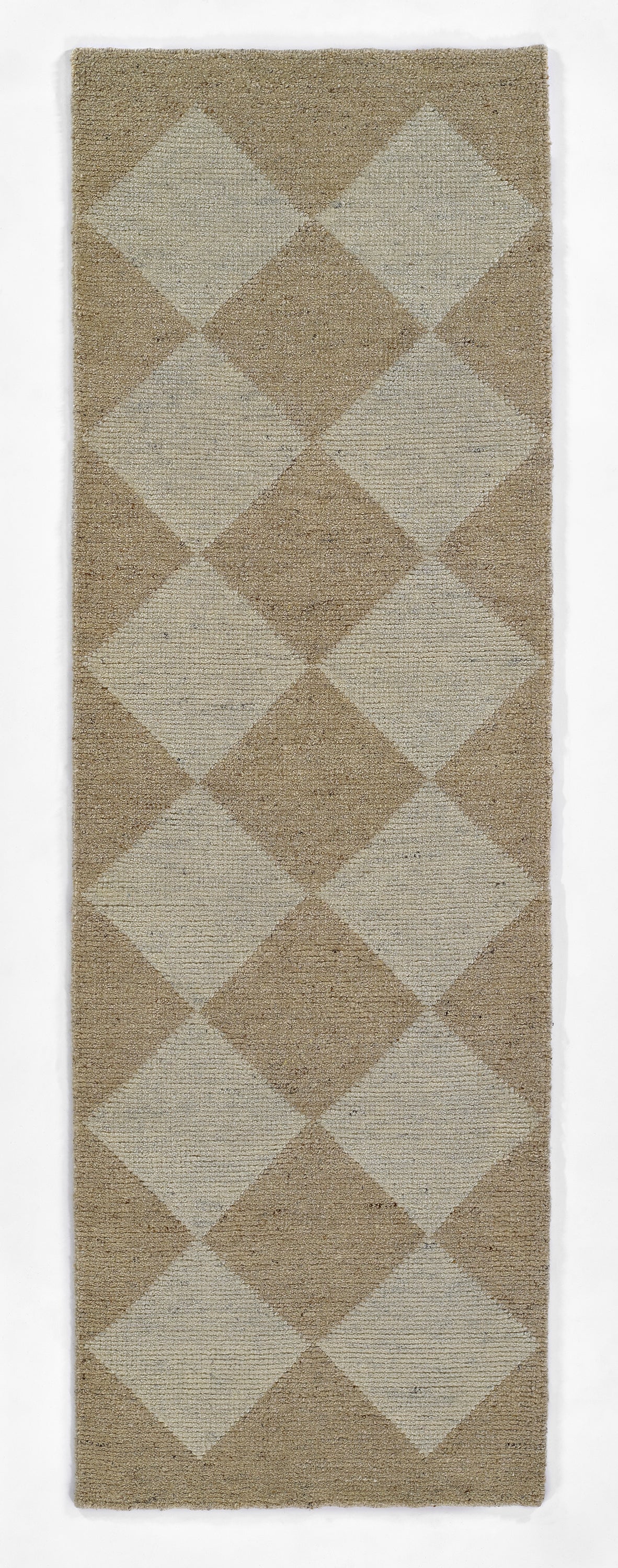 Rectangular woven rug in beige and taupe diamond argyle pattern; textured surface, versatile indoor accent.