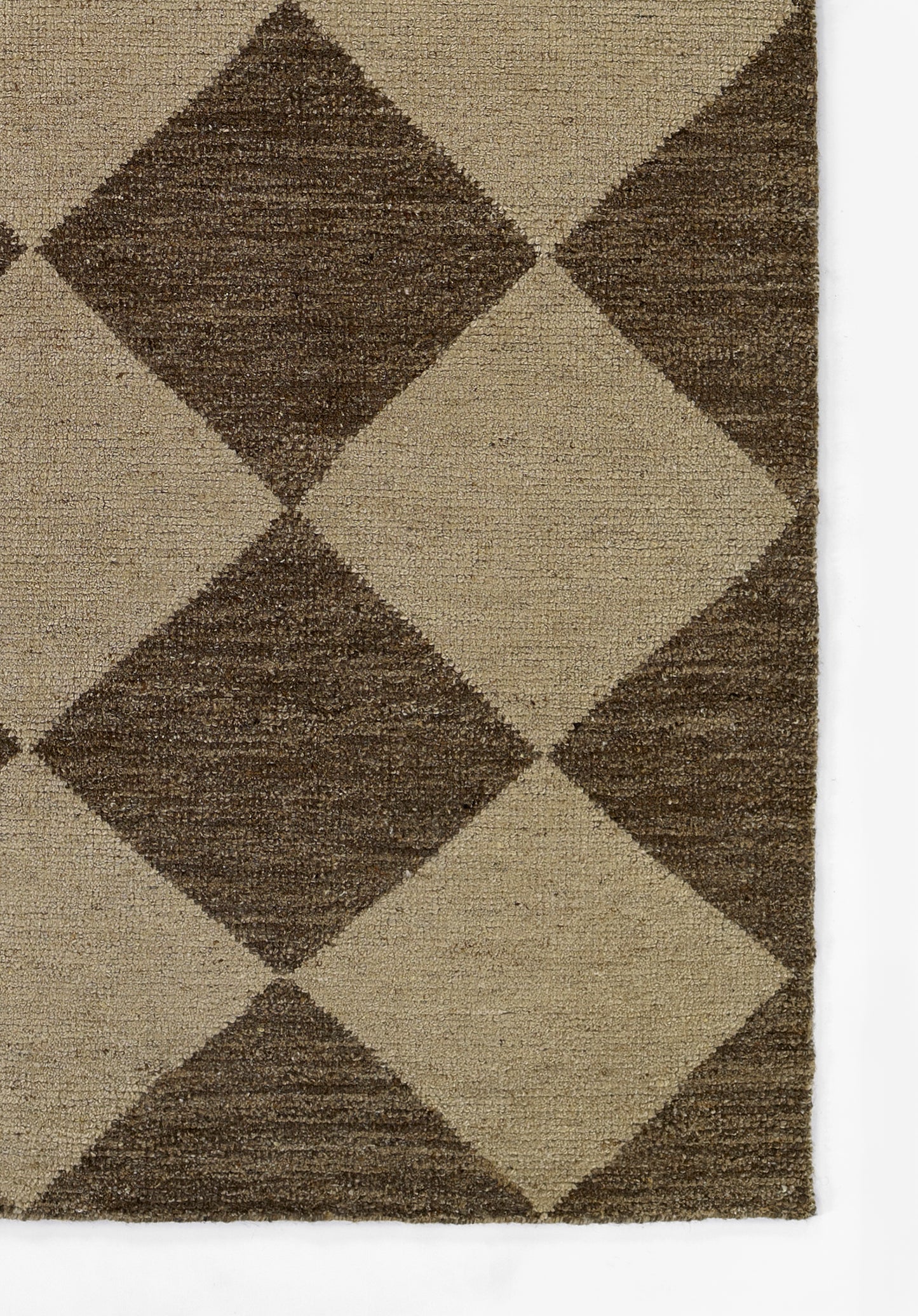 Rectangular beige and chocolate brown rug with an oversized diamond geometric pattern and a woven texture.
