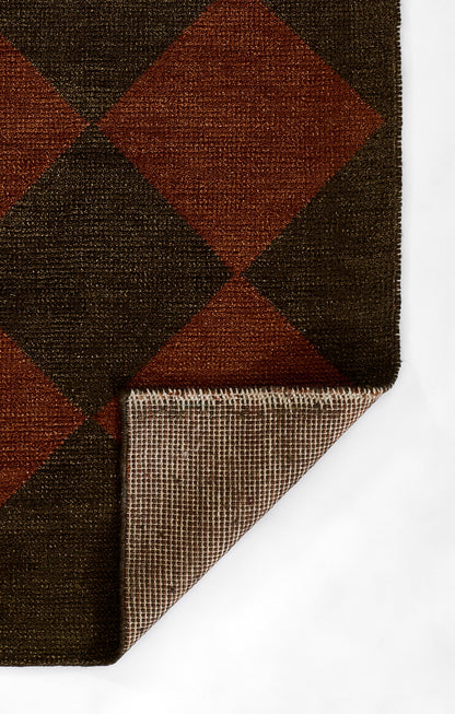 Dark brown and rust argyle wool rug with diamond pattern; folded corner reveals woven underside and edge binding
