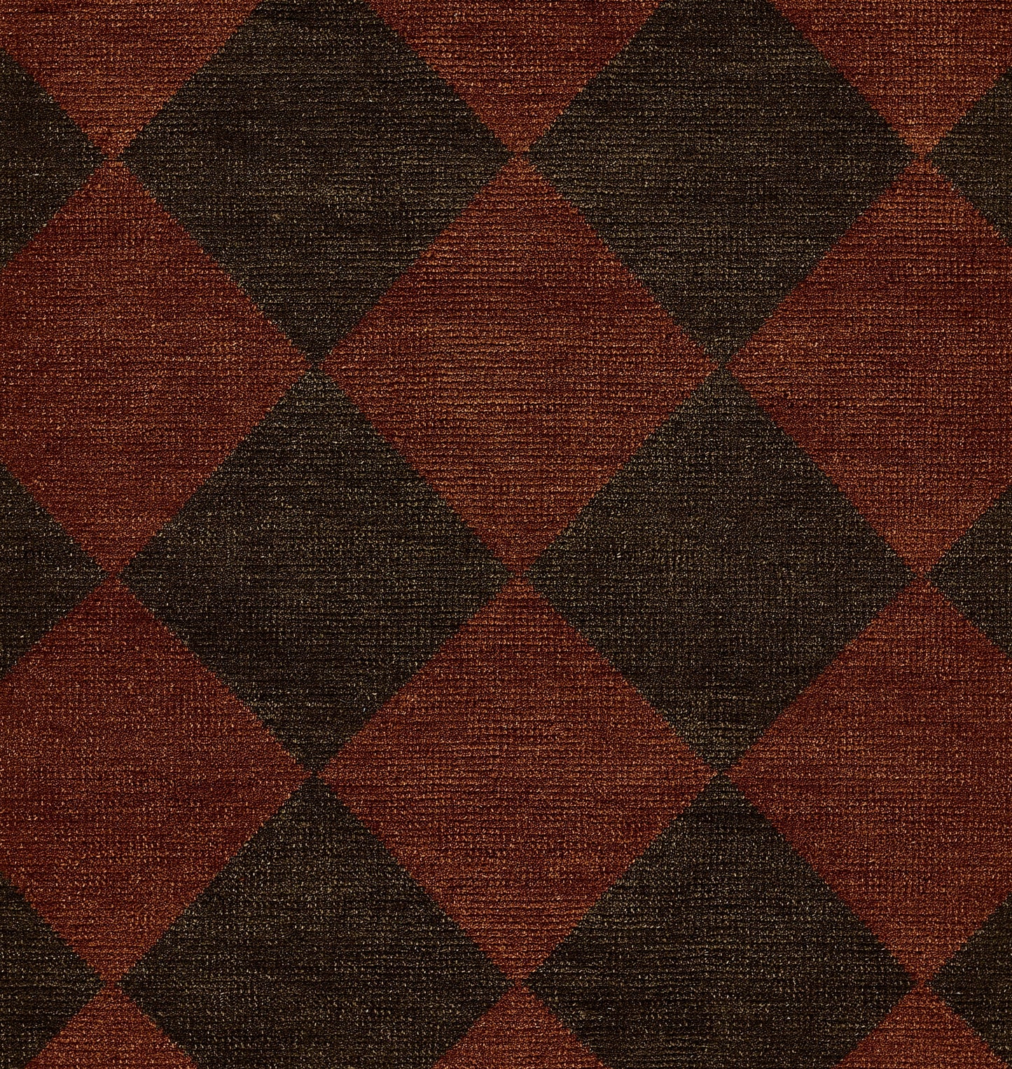 Woven wool rug in red-brown and dark brown diamond checker pattern; rustic, textured textile.