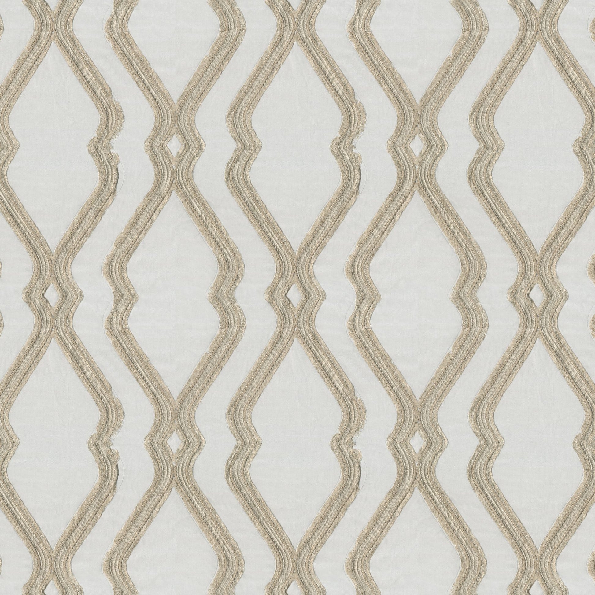 Beige ogee embroidery on pale gray textured fabric.