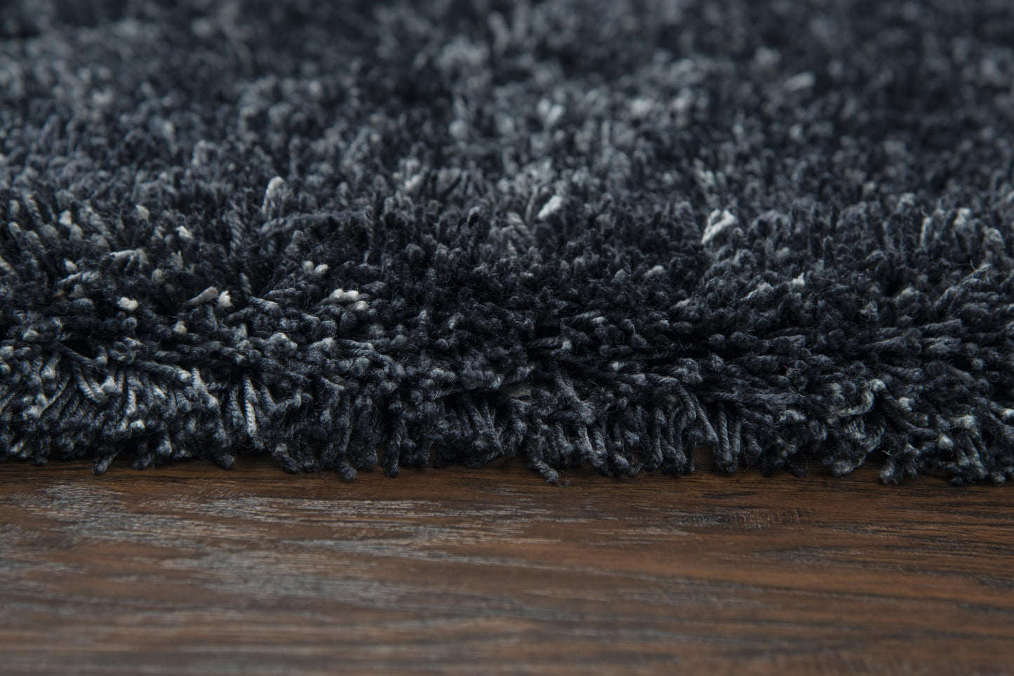 5x8 black shag area rug with ultra plush tall pile, hand tufted soft polyester rug for living room and bedroom, cozy modern solid rug with cotton canvas backing, durable high pile shag rug for contemporary home decor, soft textured charcoal rug for stylish interiors