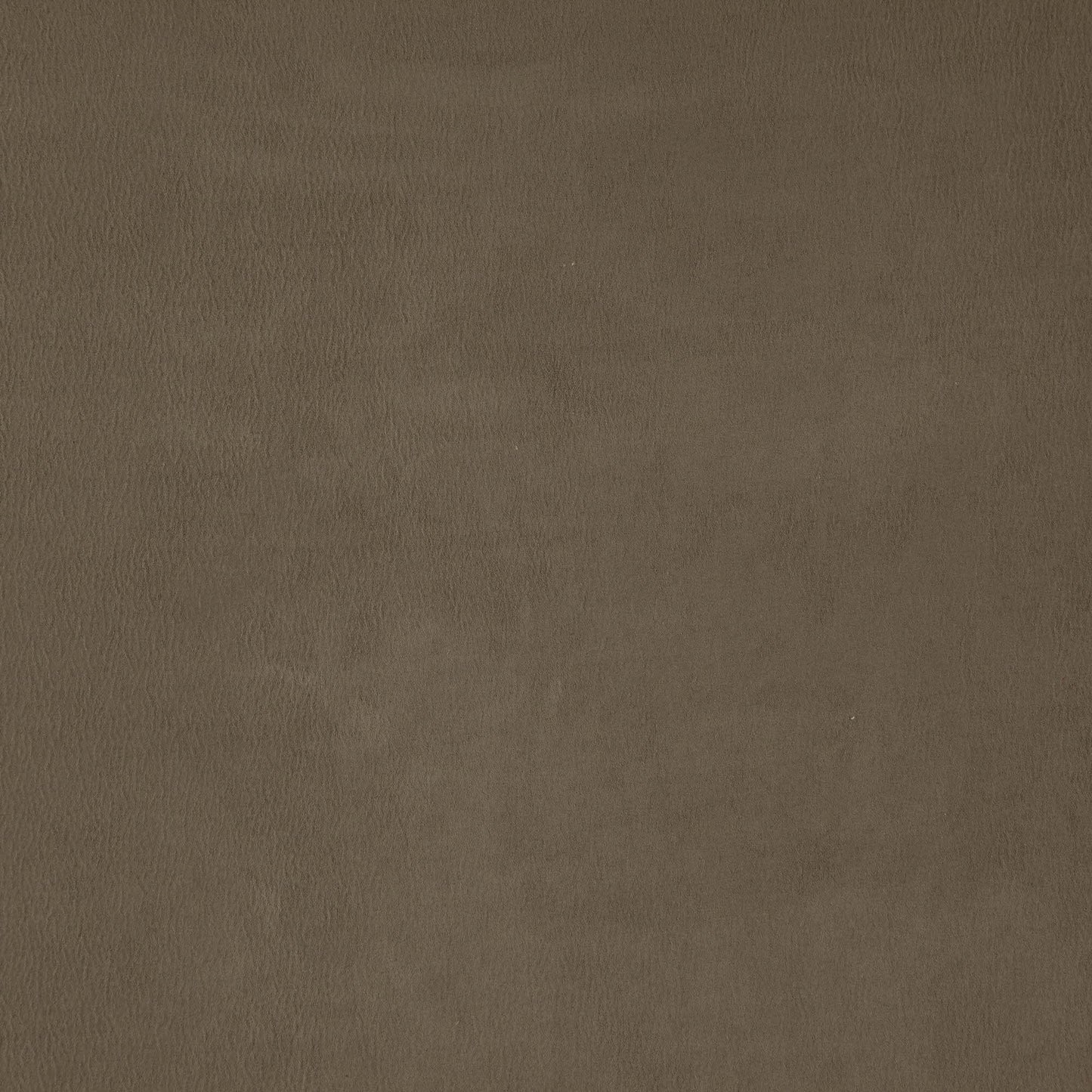 Brown faux suede fabric texture close-up with subtle grain and warm tan finish