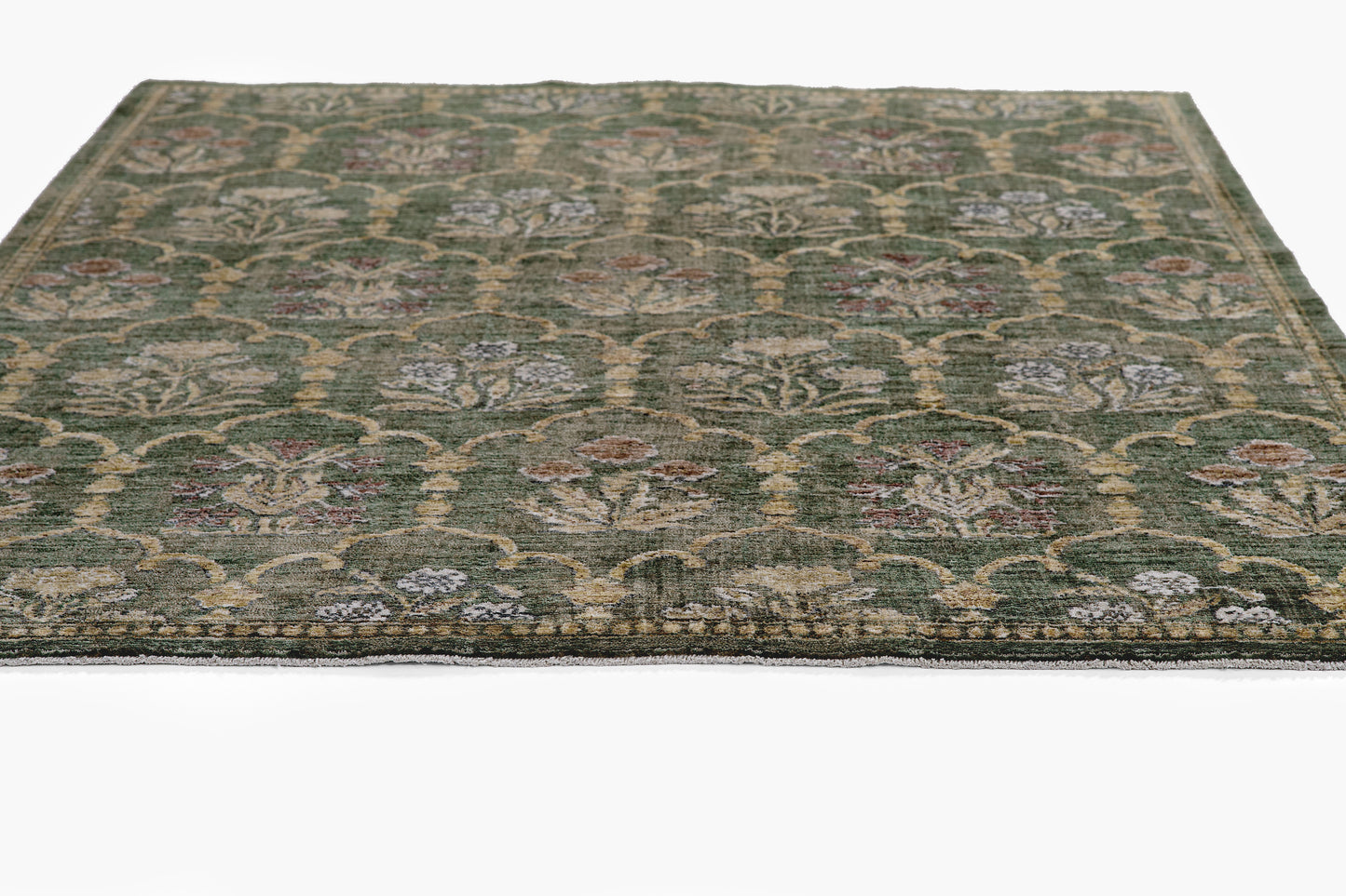 Rectangular green oriental rug with intricate gold-cream floral lattice pattern.
