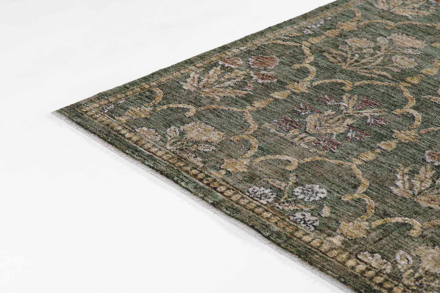Olive-green oriental-style area rug with beige & cream floral motifs; low-pile, rectangular, vintage distressed look.
