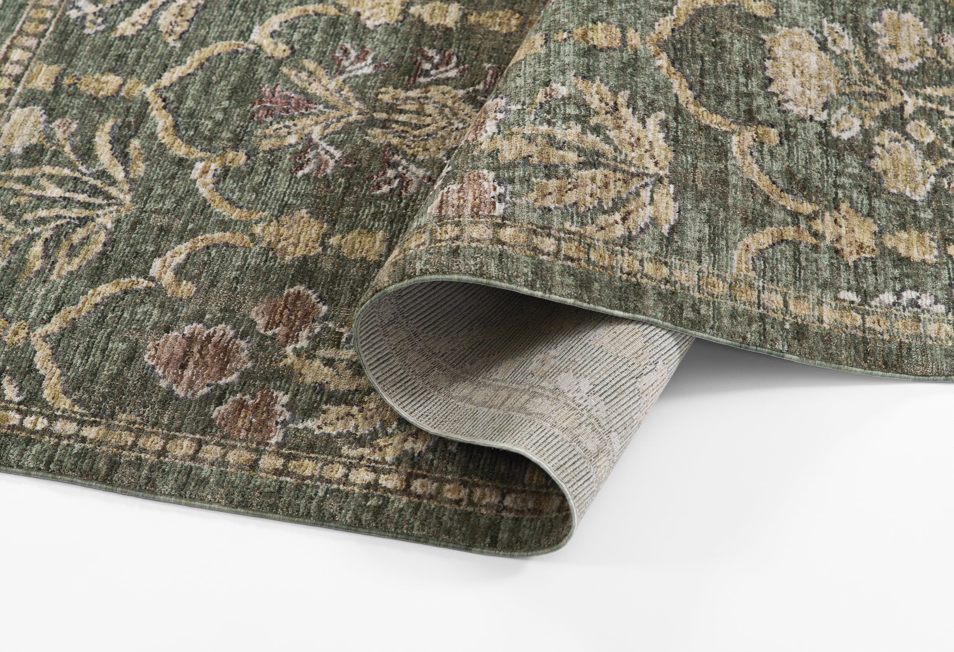Green traditional oriental rug with beige floral motifs; rectangular, woven area rug with folded edge revealing backing.