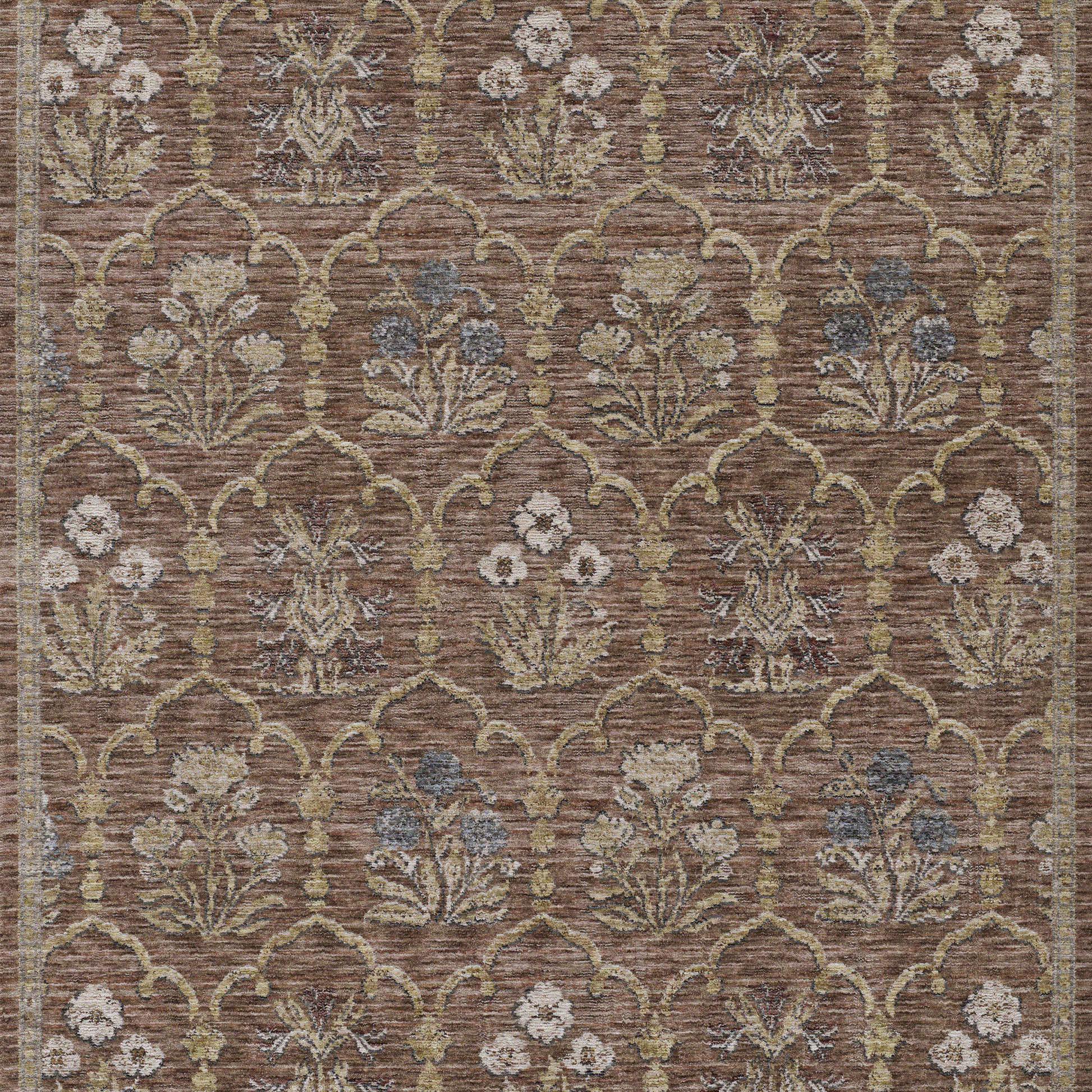 Brown woven rug with repeating lattice arches and ivory flowers with blue accents.