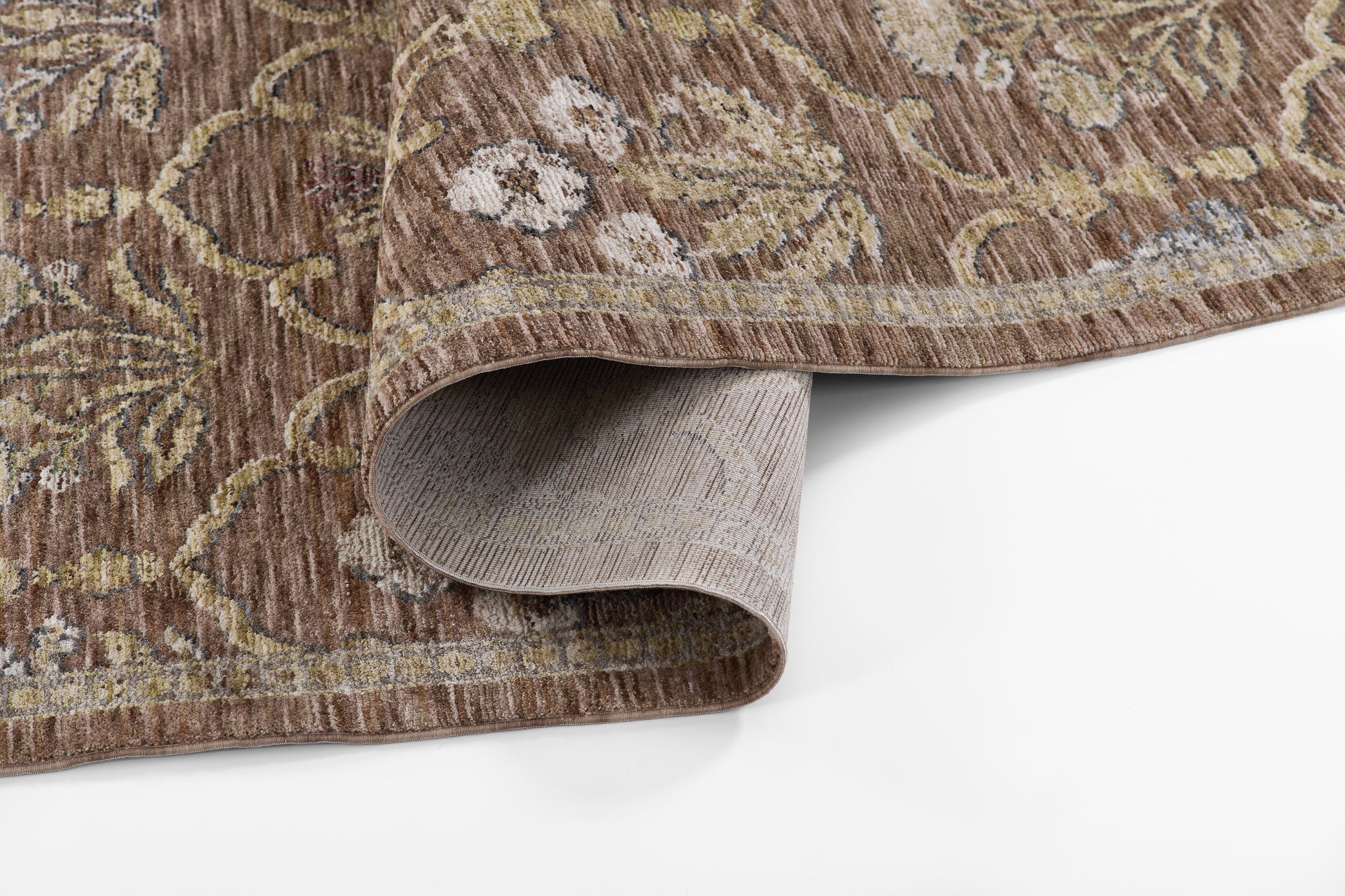 Brown oriental-style 2' x 8' runner rug with cream floral vines; low-pile, folded corner revealing beige backing.