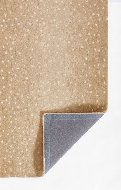 Beige rug with white speckles, soft woven texture; corner folded to reveal gray backing.