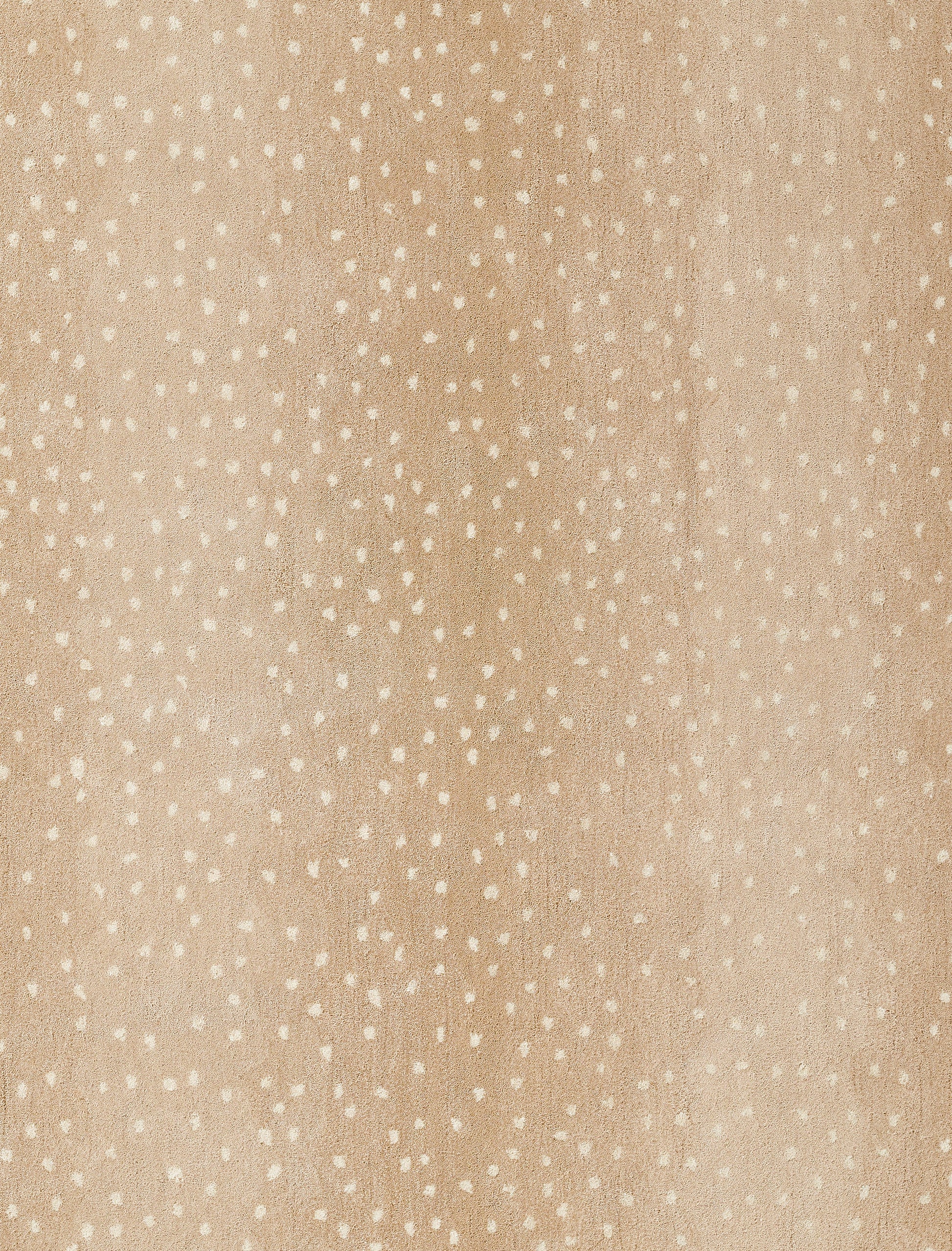 Beige speckled fabric with tiny white dots; soft textile texture for clothing or home decor.