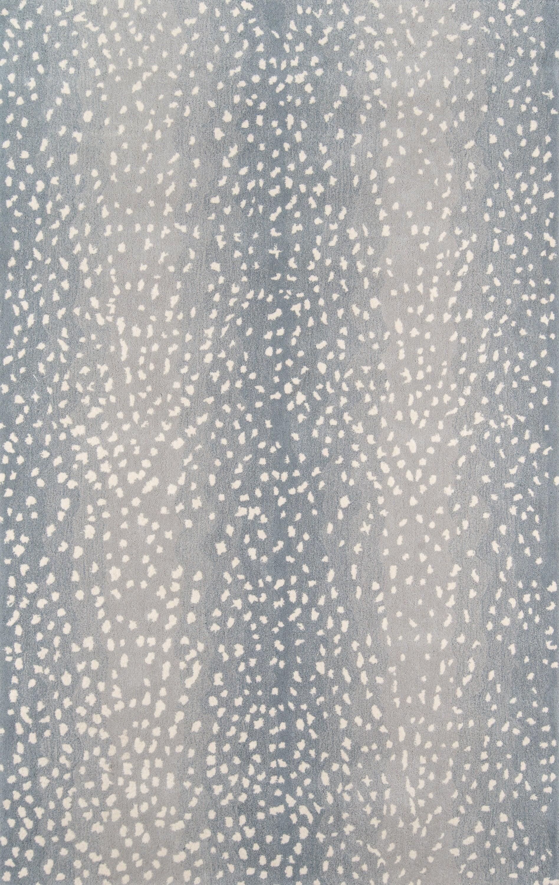Blue-gray fabric with white specks, a speckled pattern suitable for rug or upholstery.