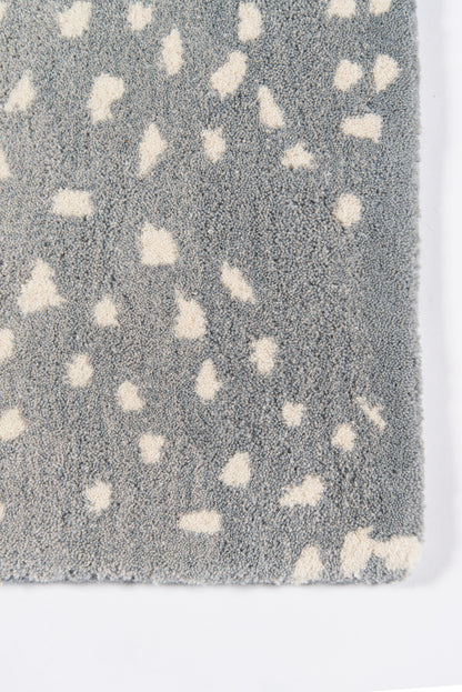 Grey plush shag rug with cream speckles; soft speckled floor mat.