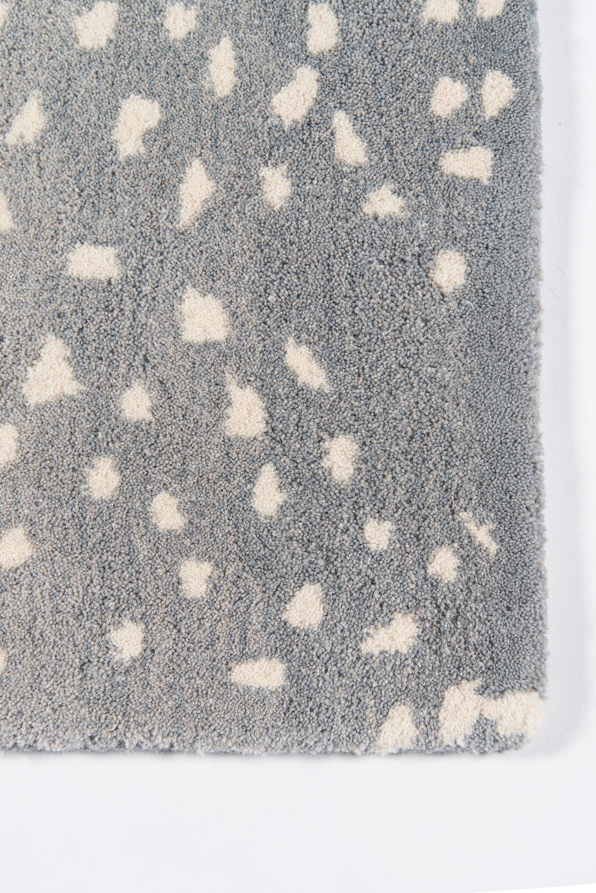 Blue-gray plush rug with irregular white flecks; modern shag style for living room or bedroom.