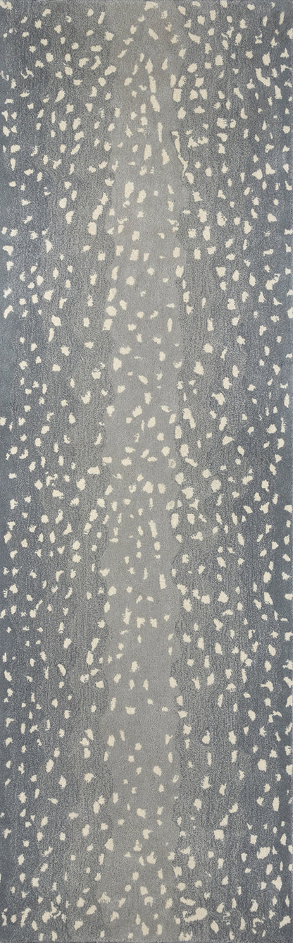 Blue-gray fabric or wallpaper with irregular cream speckle pattern in vertical streaks; modern textured design.
