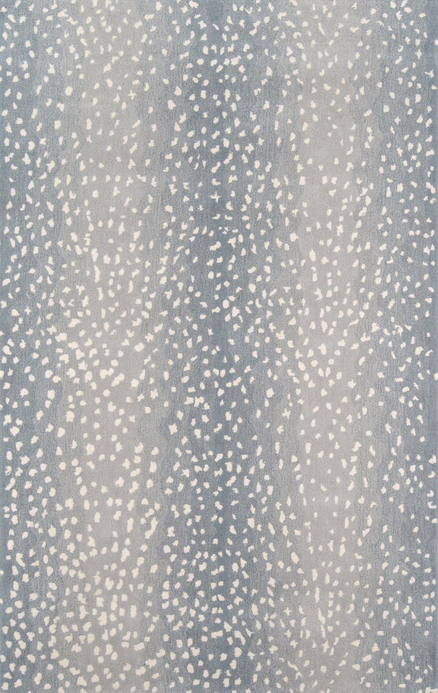 Blue speckled textile with irregular white dots; soft throw blanket or upholstery fabric.
