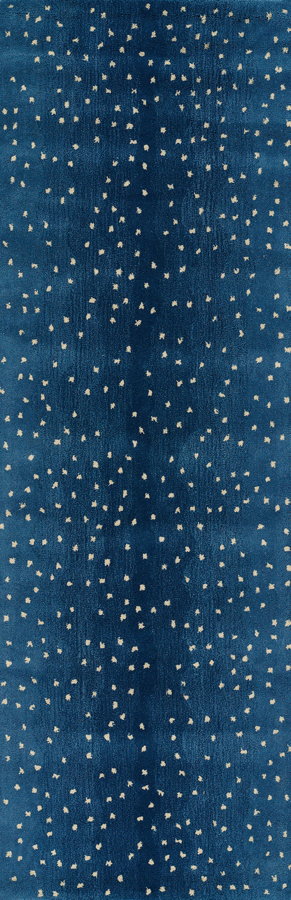 Blue rug with tiny white speckles, dotted pattern.
