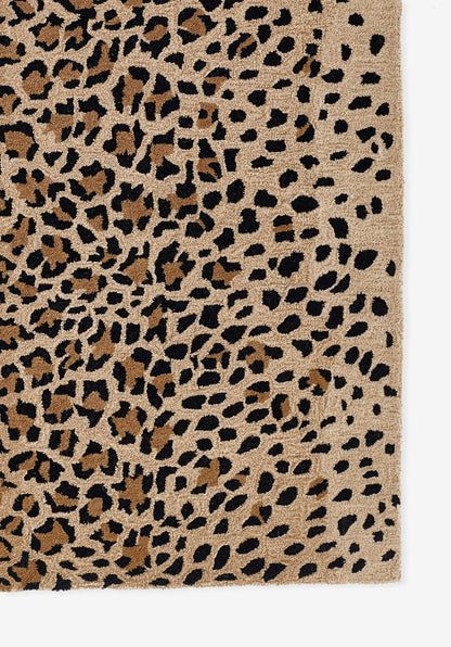 Beige leopard print rug with black irregular spots and plush textured pile.