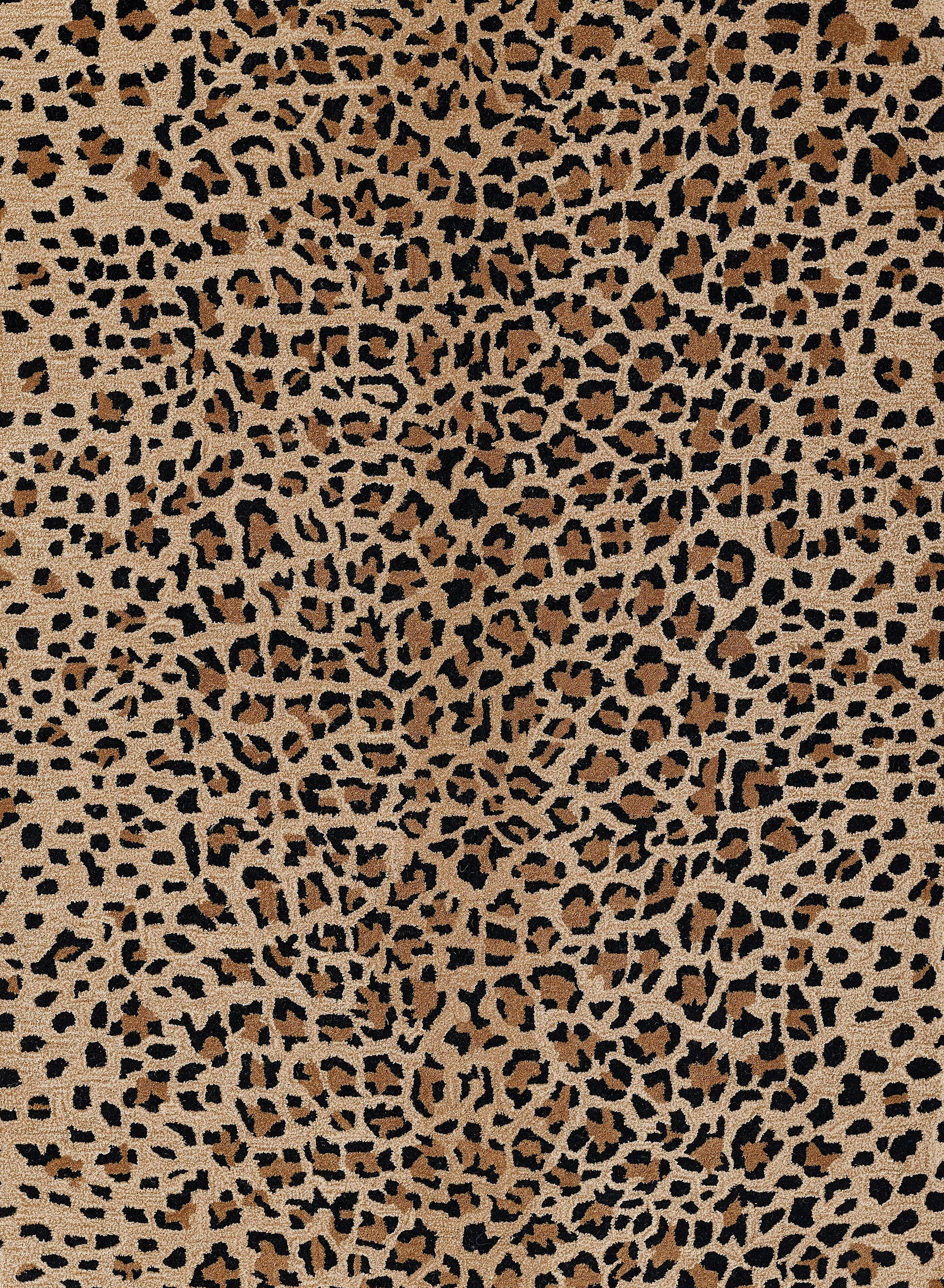 Leopard print rug in tan, brown and black with dense spots; stylish animal-pattern rug.