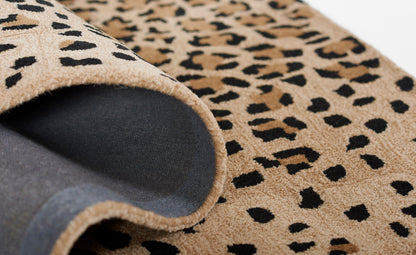 Beige leopard-print shag runner rug, 2'6" x 8', plush pile; rolled edge shows gray underside, ideal for living room decor.