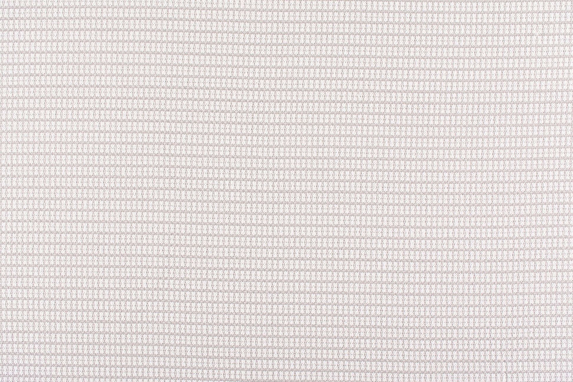 Beige textured woven fabric close-up with tiny grid pattern; soft, neutral upholstery material.