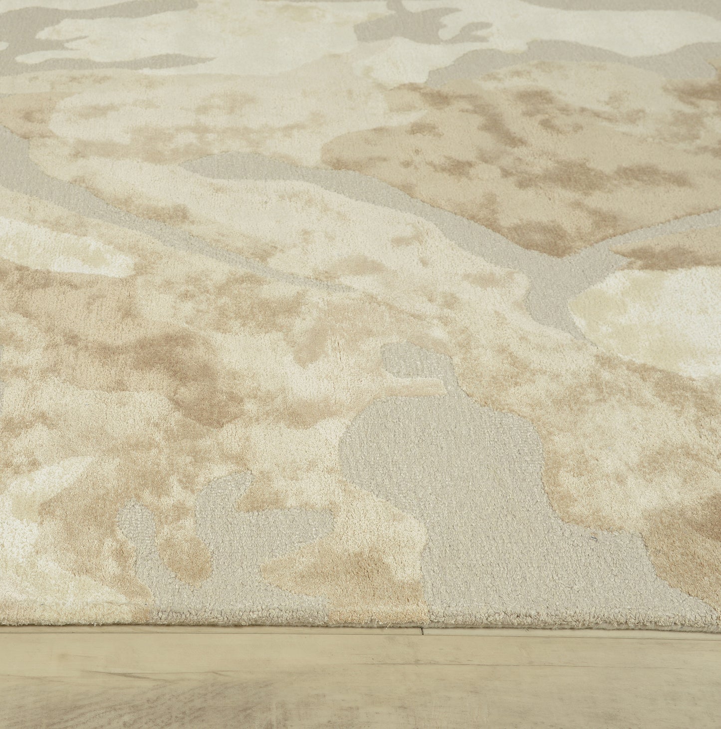 Contemporary rug with a subtle wave pattern in neutral tones, 2' x 3'.