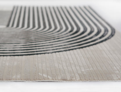 Beige woven runner rug with bold black curved stripe motif; modern geometric design.