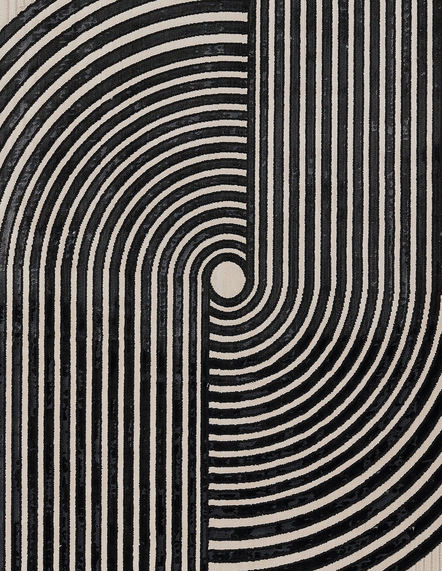 Ivory and black geometric rug with concentric circles and vertical stripes; 2' x 8' runner.
