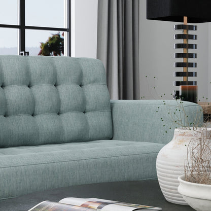 Teal pool solid fabric swatch in a modern living room setting with gray curtains, stacked-ring floor lamp, and white vases.
