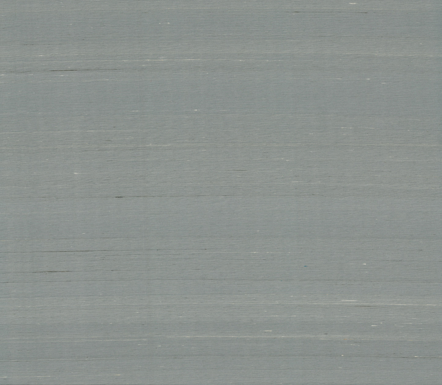 Dusty blue wallpaper with a subtle woven texture.
