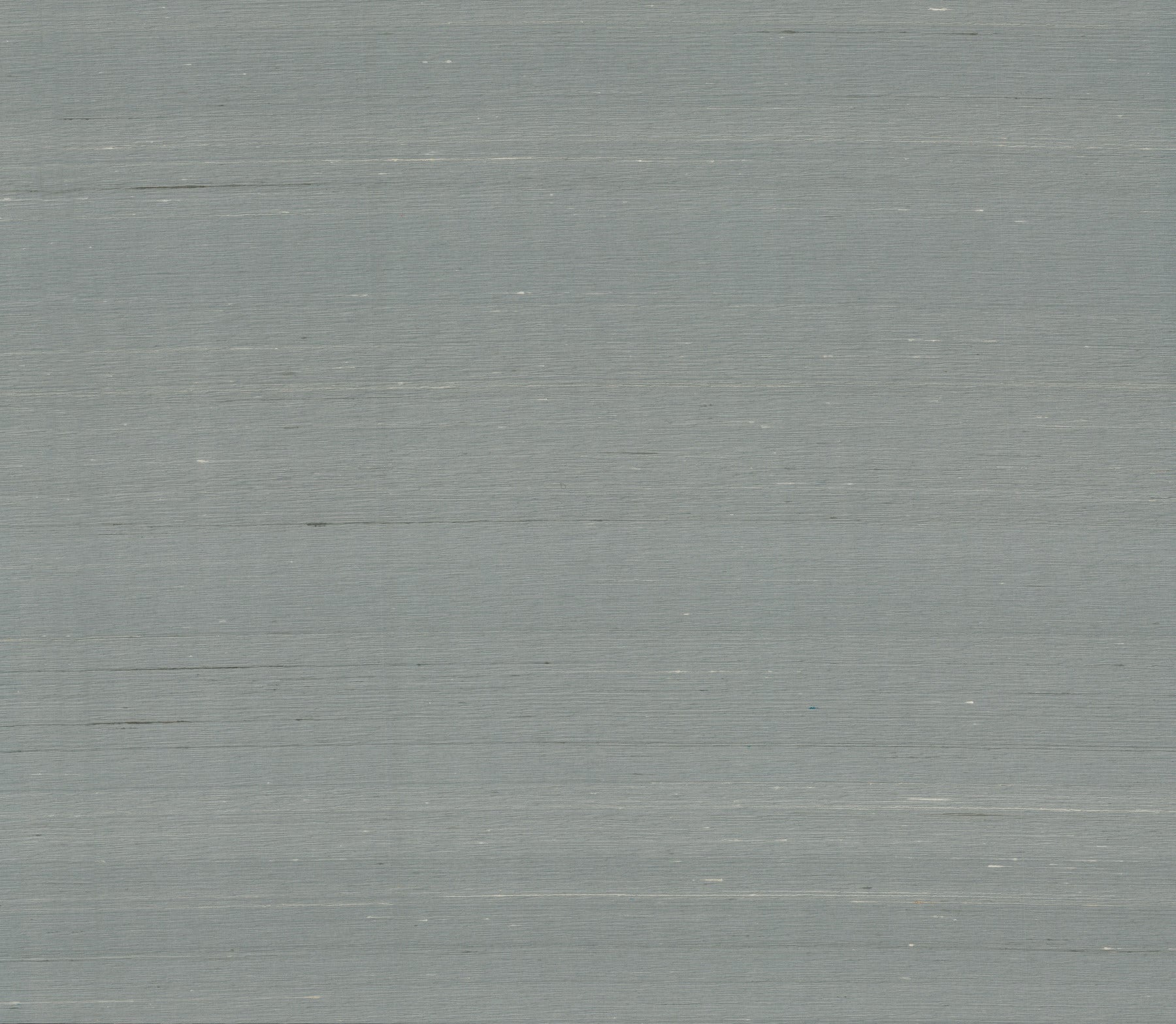 Dusty blue wallpaper with a subtle woven texture.