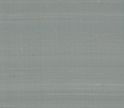Dusty blue wallpaper with a subtle woven texture.