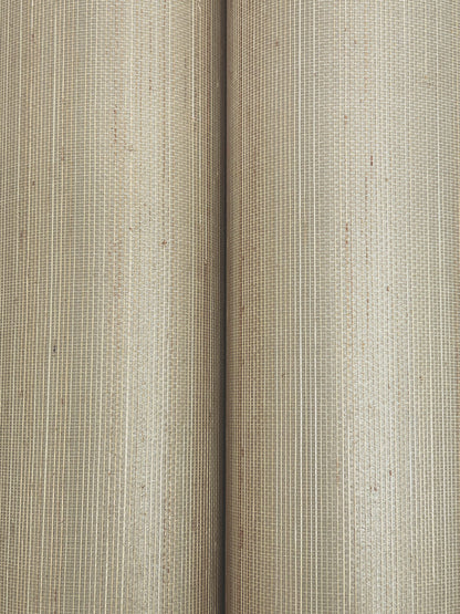 Beige natural-fiber wallpaper rolls with ribbed woven texture; rustic wallcovering detail.