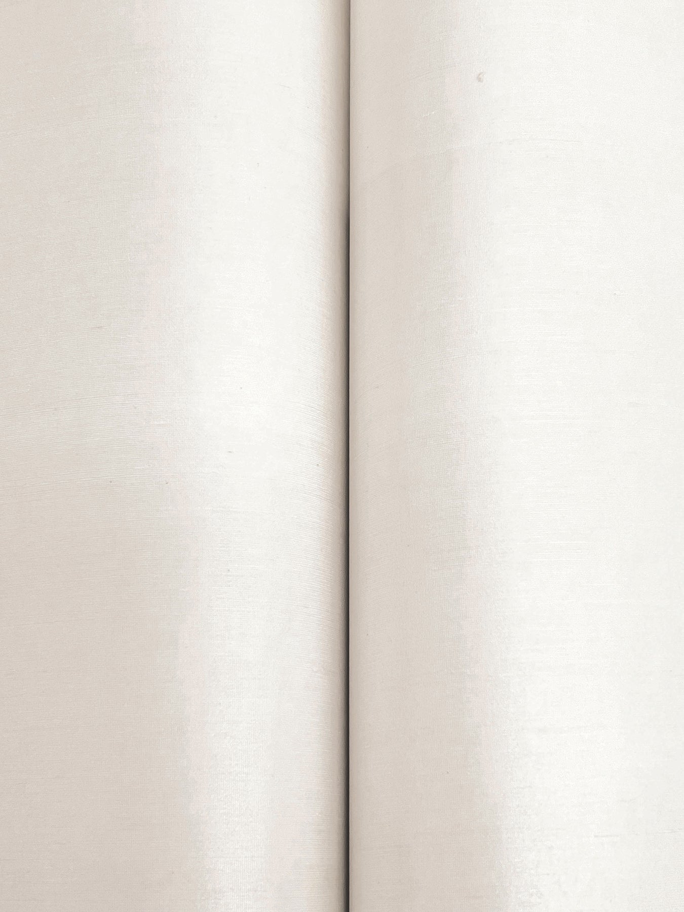 Close-up of warm beige linen-like wallpaper texture with a vertical seam between two panels.
