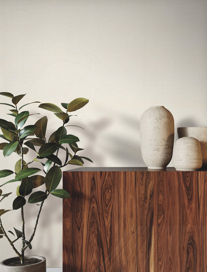 Magnolia wallpaper in natural tones with a subtle weave pattern on the wall.