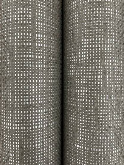 Two gray wallpaper rolls with a white square grid pattern.