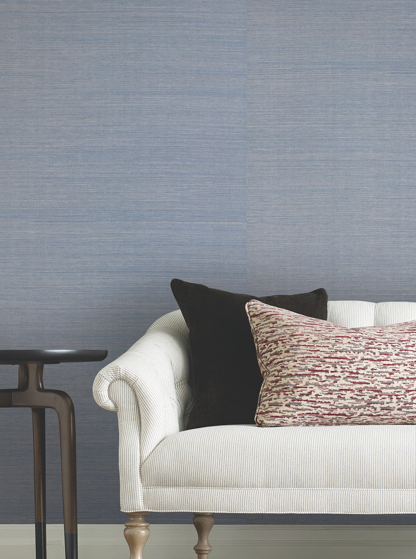 Dusty Sky grasscloth wallpaper on wall with a natural textured fiber pattern.