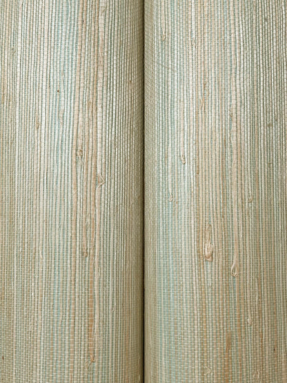 Close-up of pale vertical wooden planks with a subtle green tint, showing grain and knots for wall paneling.