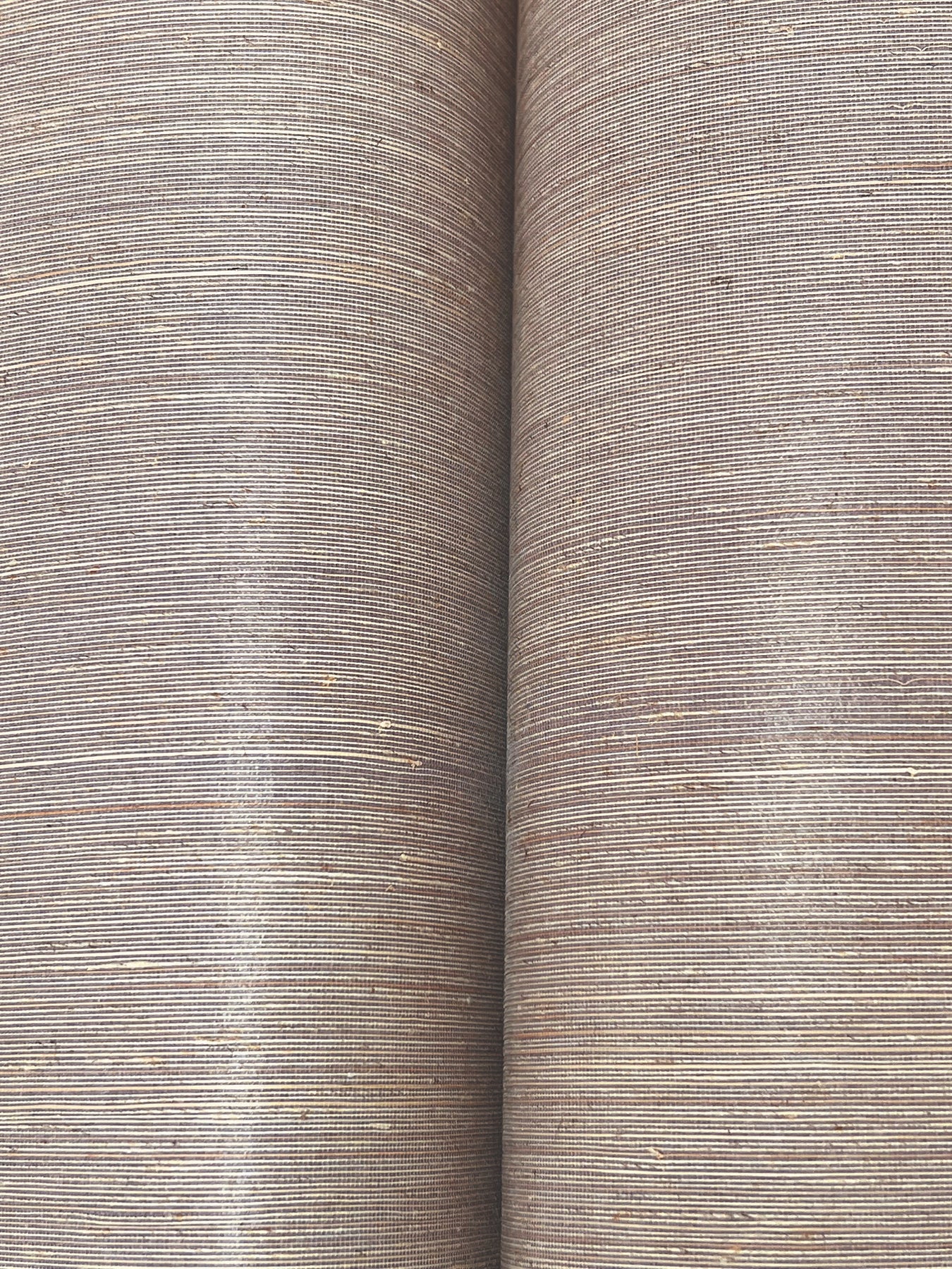 Two lilac abaca grasscloth wallpaper strips with a natural woven texture.