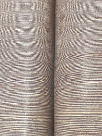 Two lilac abaca grasscloth wallpaper strips with a natural woven texture.