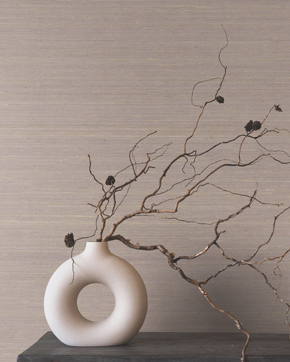 Lilac grasscloth wallpaper with natural fiber texture on a wall.