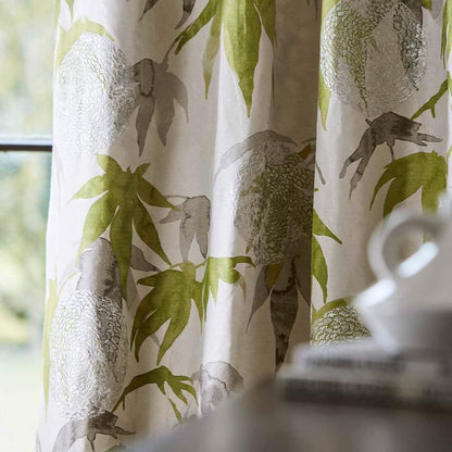 Close-up view of Zoffany Acer “Platinum / Leaf” fabric showing embroidered trailing leaf motif and chrysanthemum accents on a silk‑linen blend in soft platinum and leaf tones — perfect for elegant drapery, cushions, or accent upholstery.