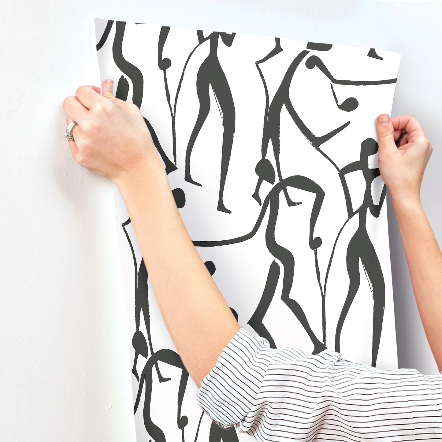 Black wallpaper featuring white abstract line-drawn dancers; minimalist modern wall decor.
